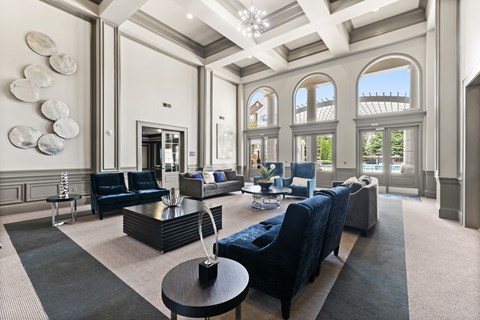 a living room with couches and chairs and a fireplace